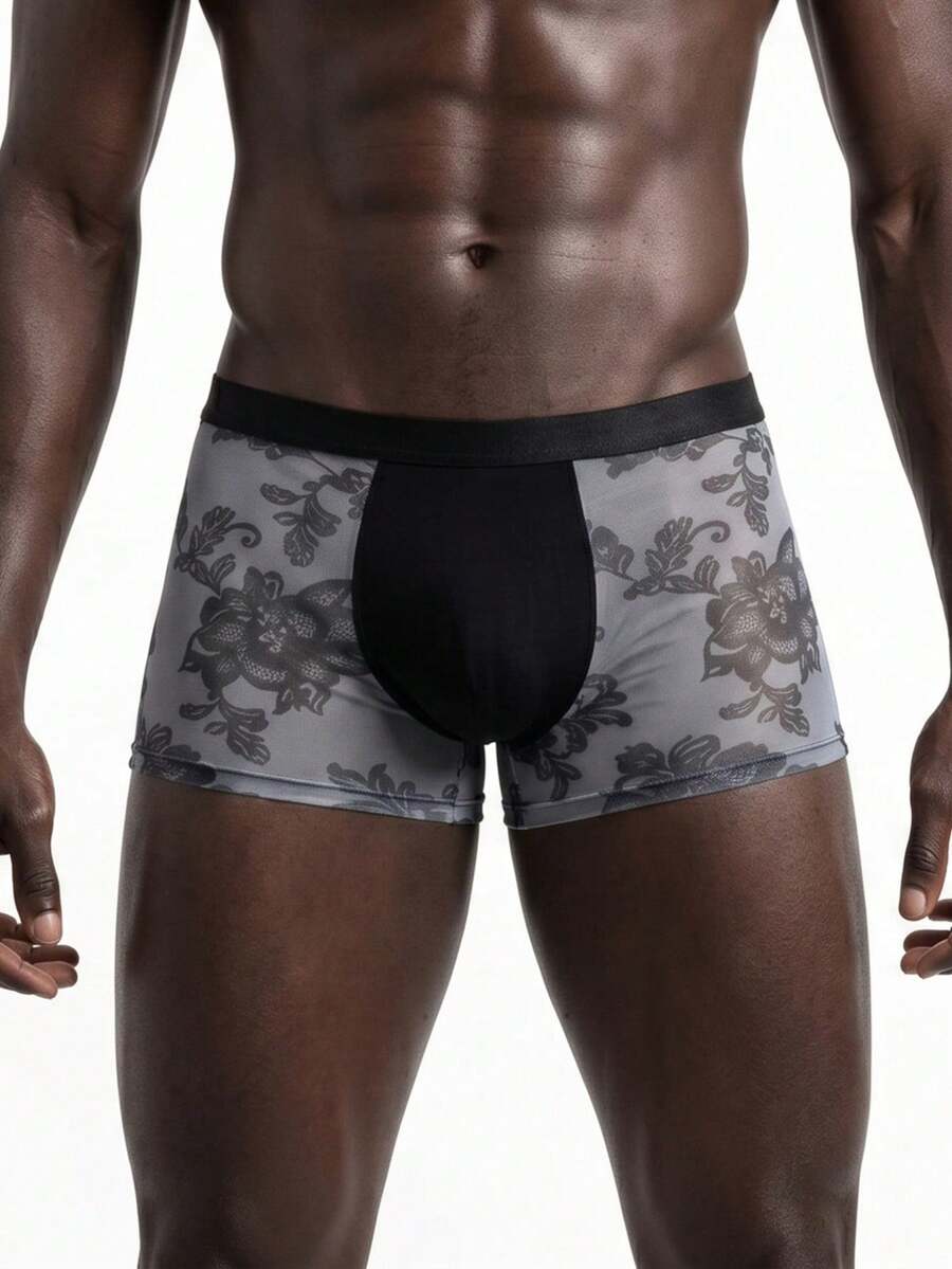 Rest Era men's grey semi-sheer mesh boxer briefs featuring a low rise fit, contrast binding, and plant pattern.