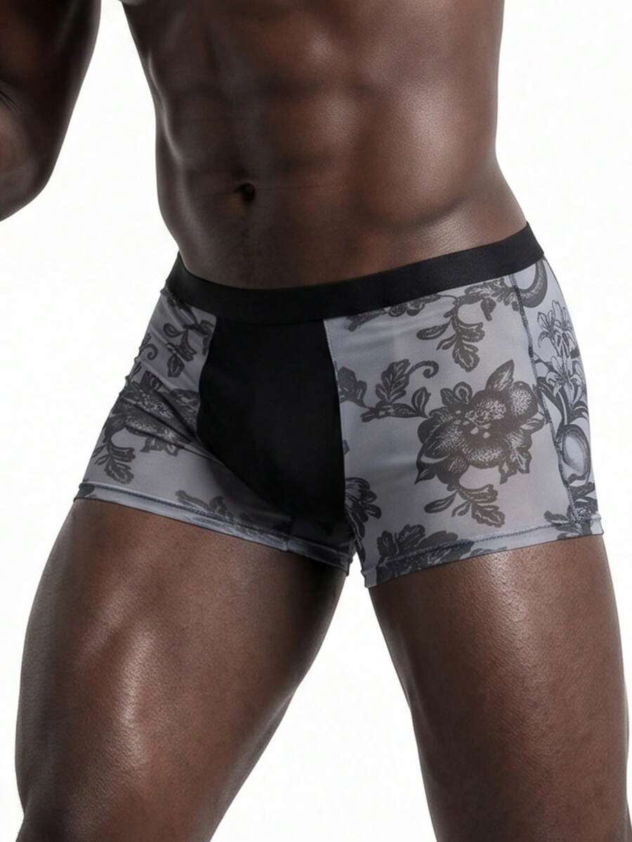 Rest Era men's grey semi-sheer mesh boxer briefs featuring a low rise fit, contrast binding, and plant pattern.