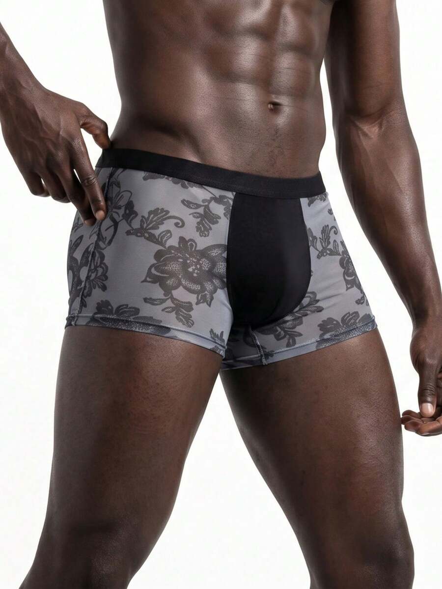 Rest Era men's grey semi-sheer mesh boxer briefs featuring a low rise fit, contrast binding, and plant pattern.