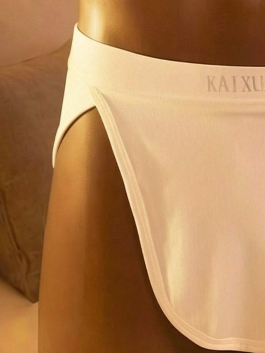 Men's plain white shiny low rise flat boxer shorts.