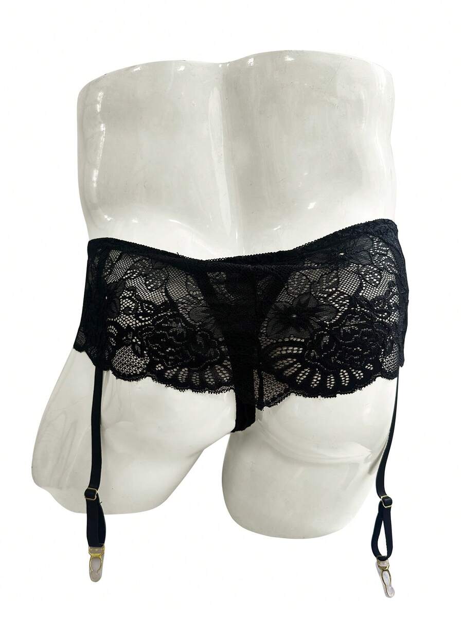 Black men's low waist lace contrast mesh garter style boxer shorts featuring medium stretch fabric and plain pattern.