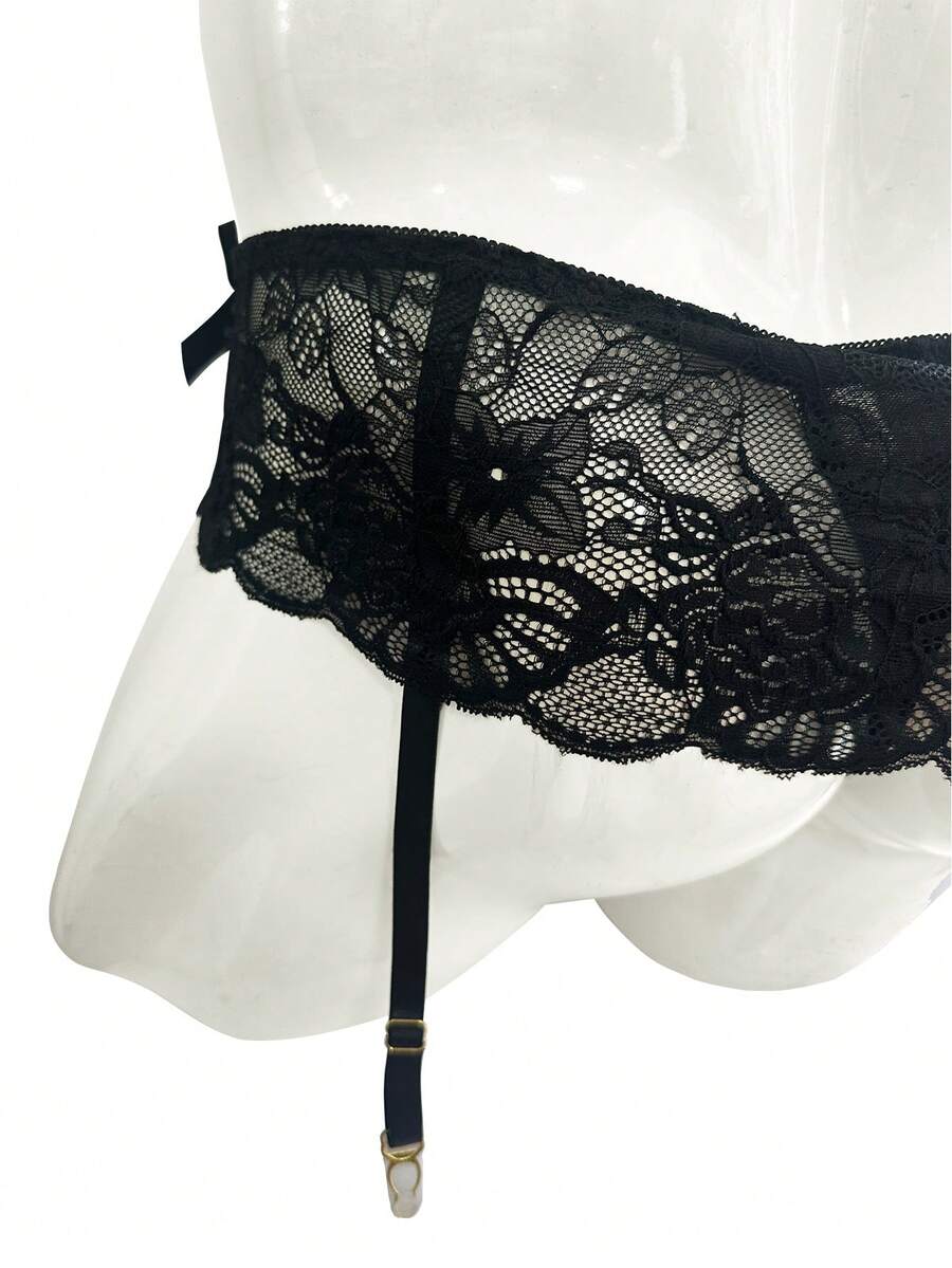 Black men's low waist lace contrast mesh garter style boxer shorts featuring medium stretch fabric and plain pattern.